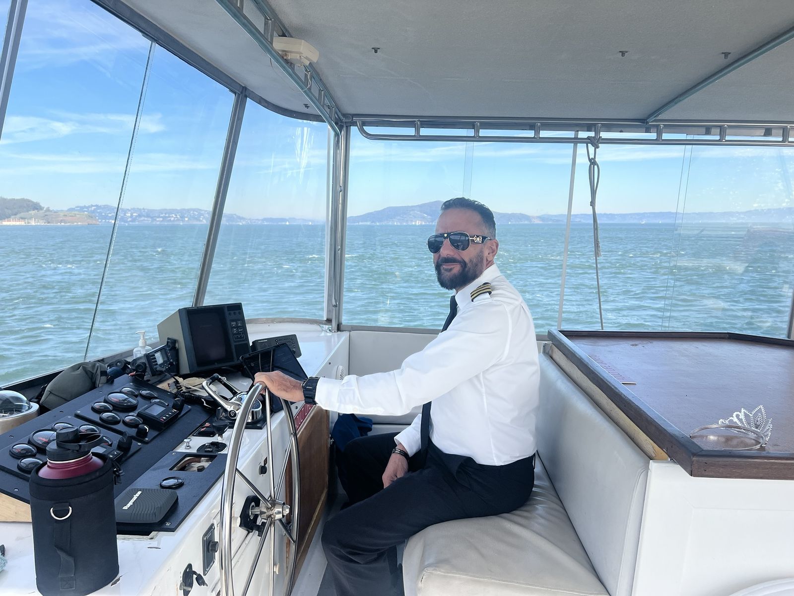Captain Arlan at the helm on San Francisco Bay