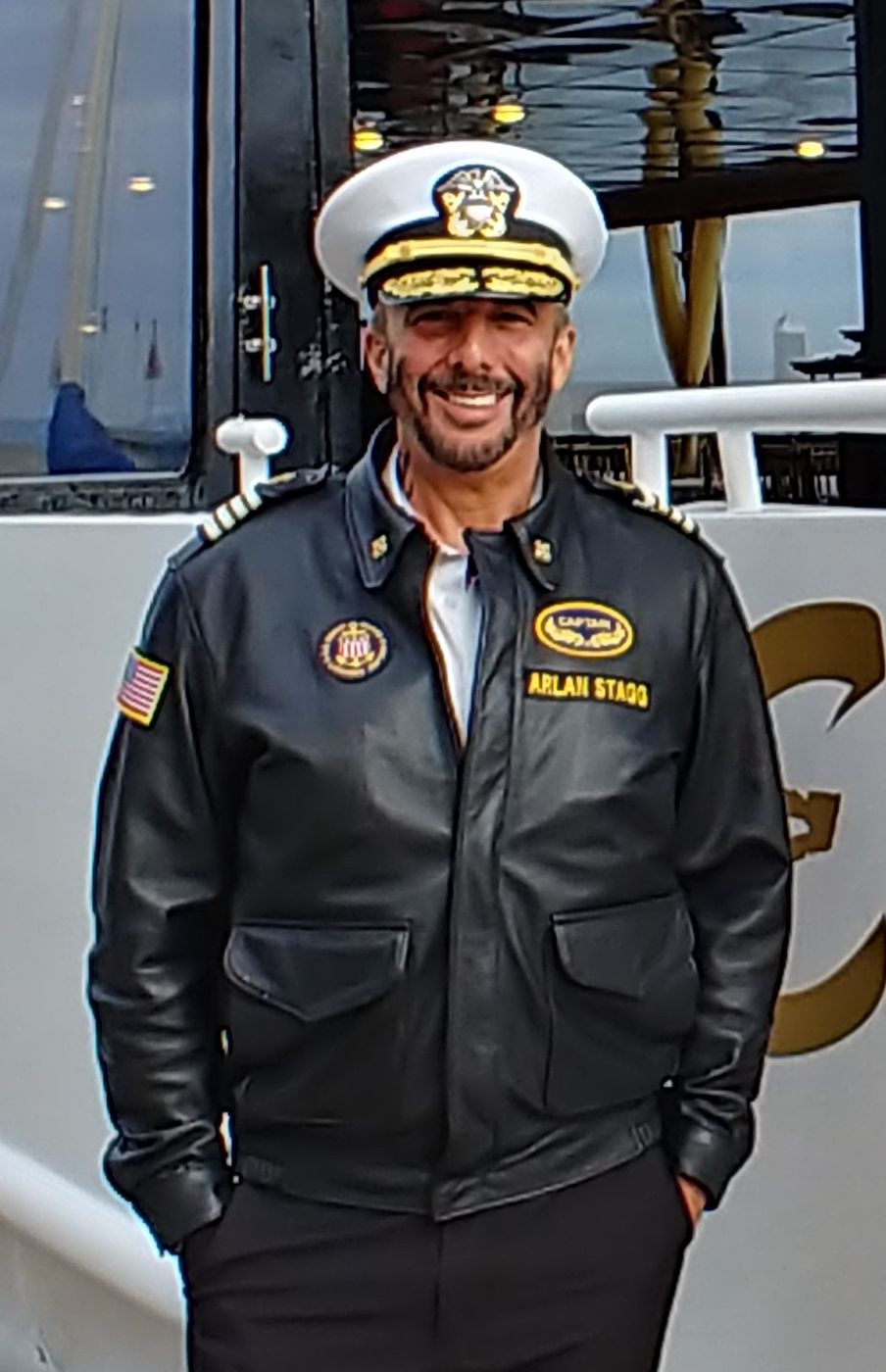 Captain Arlan Stagg in his captain's jacket and cap