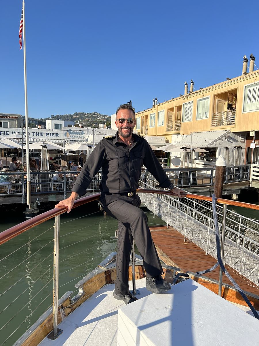 Captain Arlan on the bow at the Sausalito waterfront